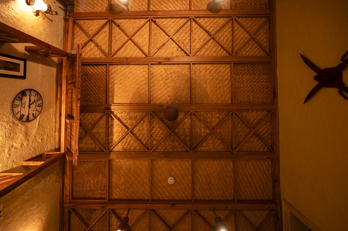 Traditional bamboo-reed ceiling with wooden beam framework